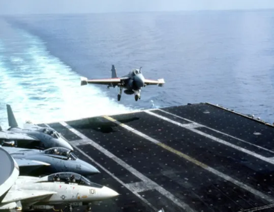 Airplane landing on Aircraft Carrier